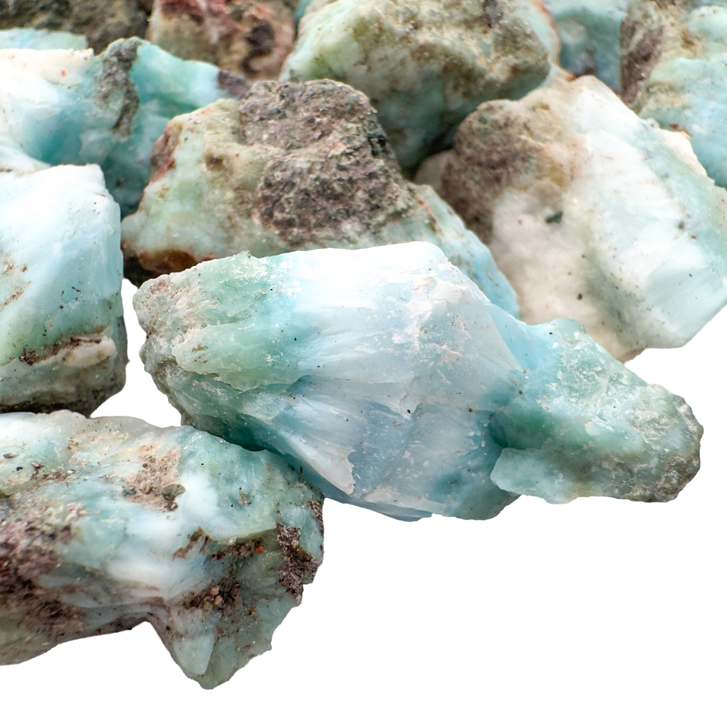 Dense pile of Larimar raw stones showing typical batch mix, A grade Dominican Republic