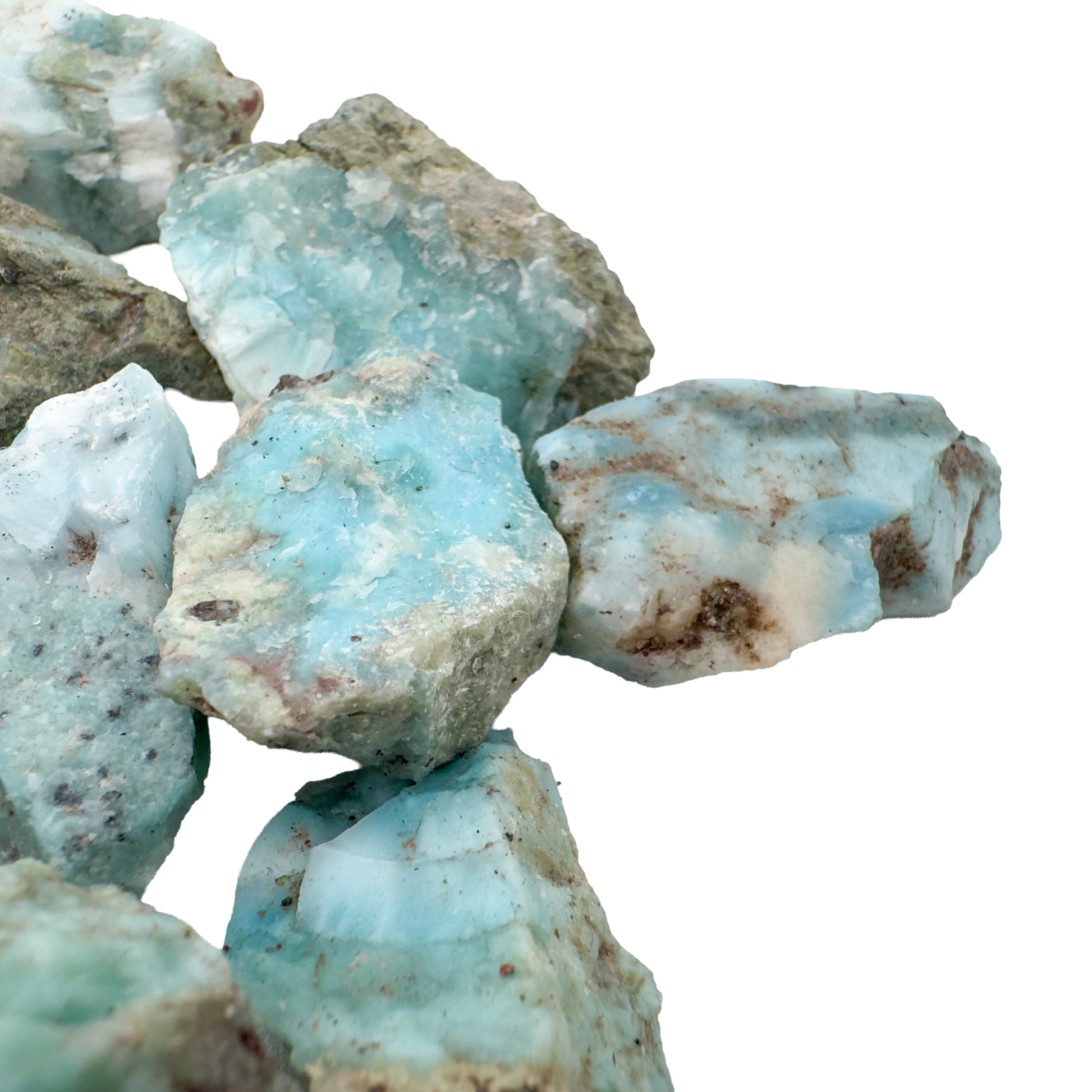 Larimar rough stones grouped to show scale and blue and white pattern variation