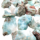 Overhead pile of A grade Larimar raw crystals from the Dominican Republic, sold by piece or pound