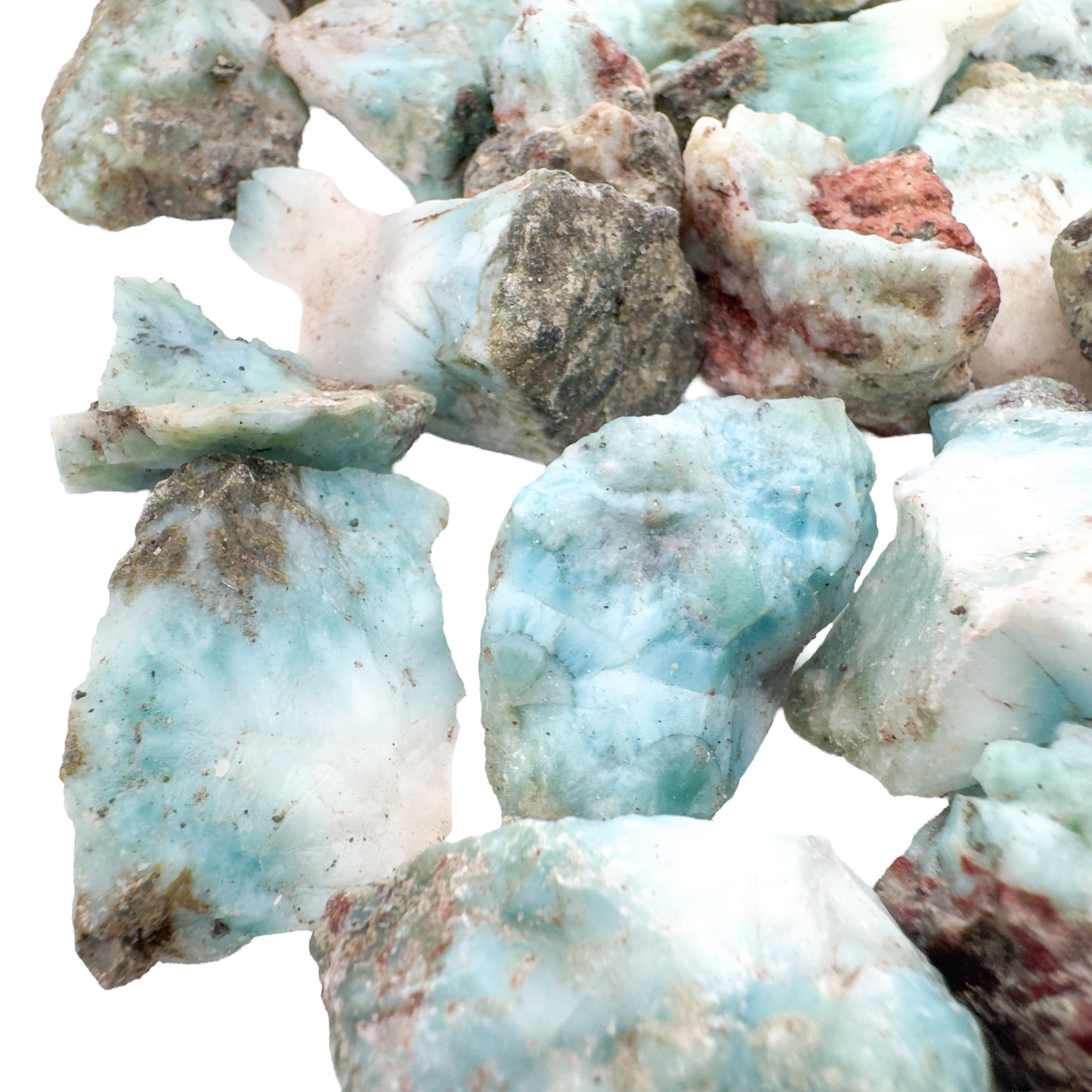 Overhead pile of A grade Larimar raw crystals from the Dominican Republic, sold by piece or pound