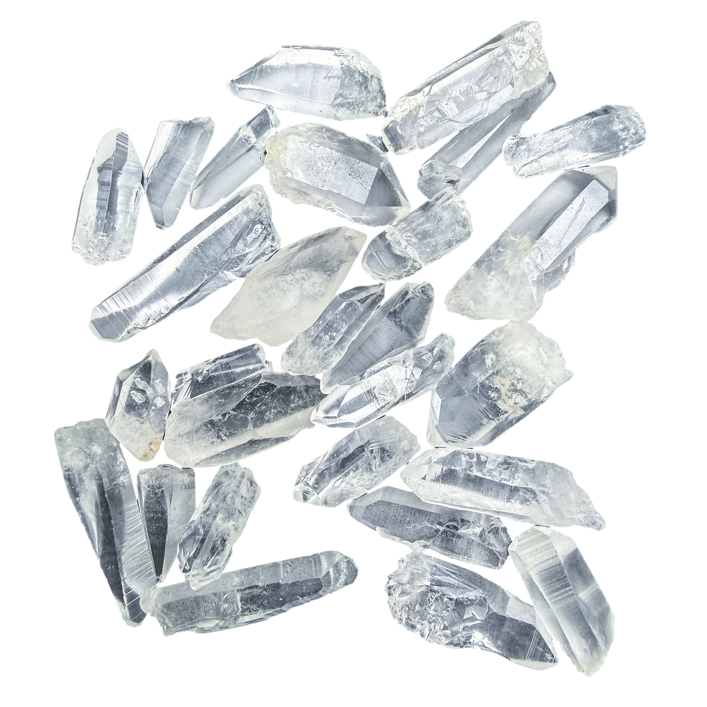 Lemurian Quartz points laid out flat, 10 to 30 grams each, ladder-like growth striations visible across the faces.