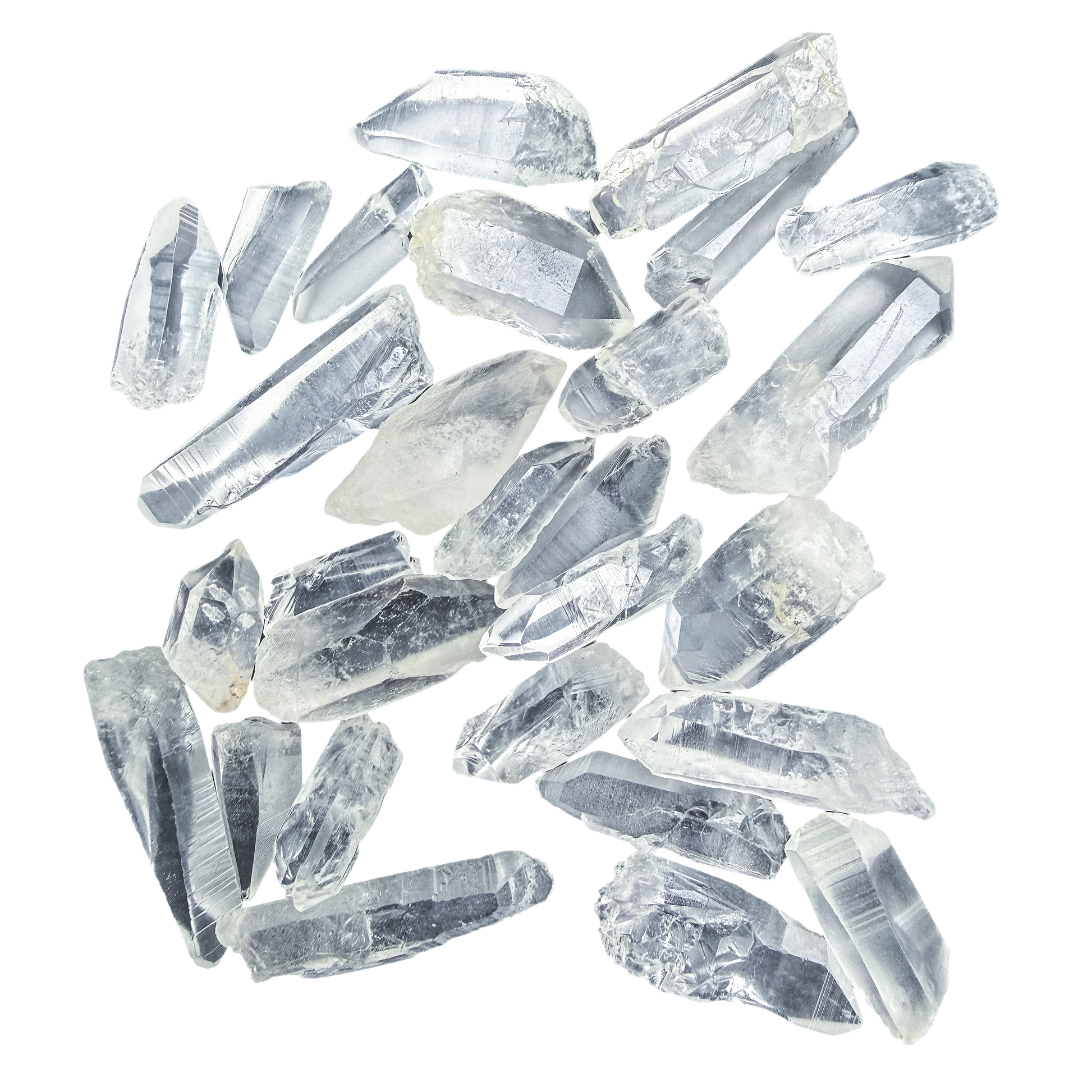 Lemurian Quartz points laid out flat, 10 to 30 grams each, ladder-like growth striations visible across the faces.