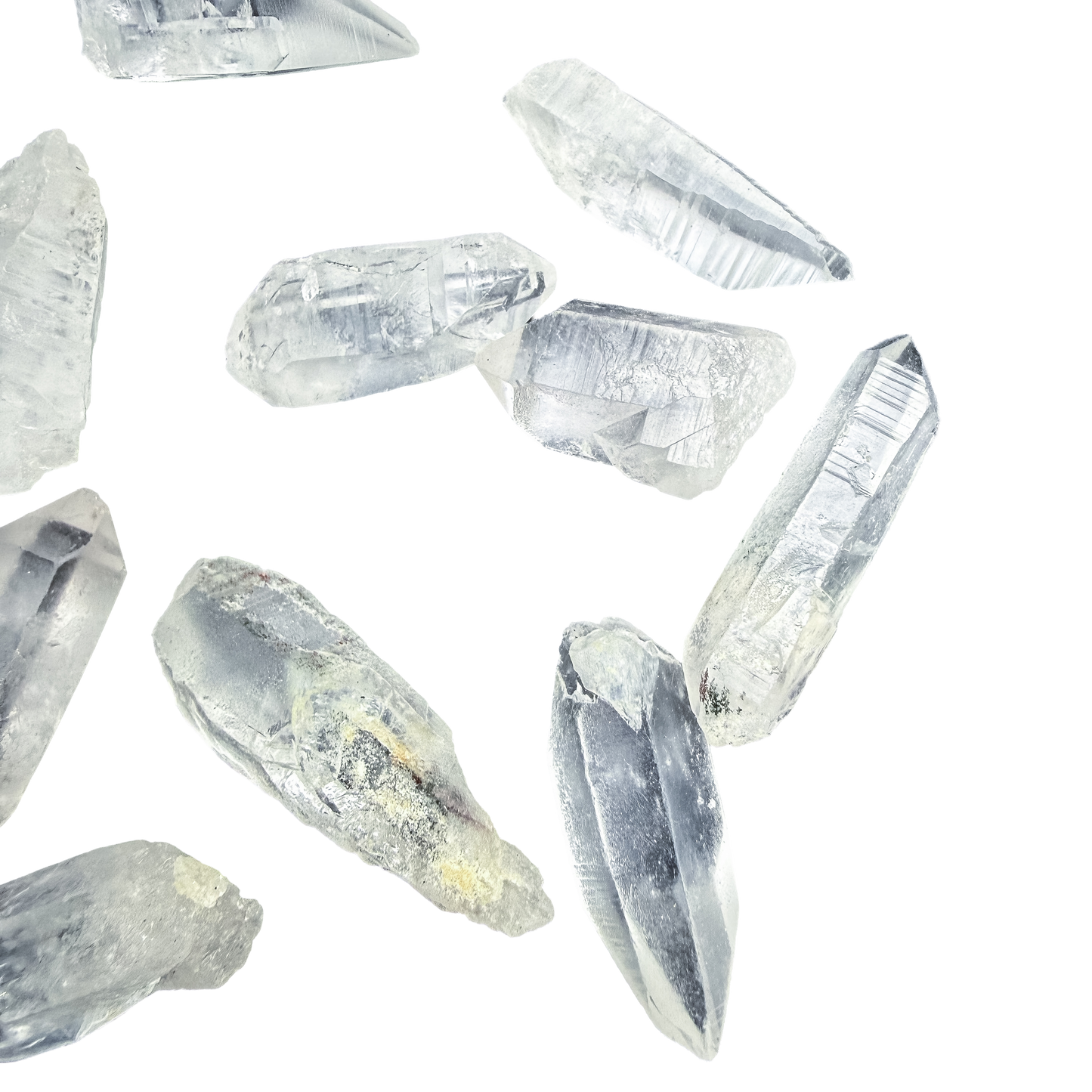 A handful of Minas Gerais Lemurian Quartz at 24-40 pieces per pound, striated faces toward the camera.