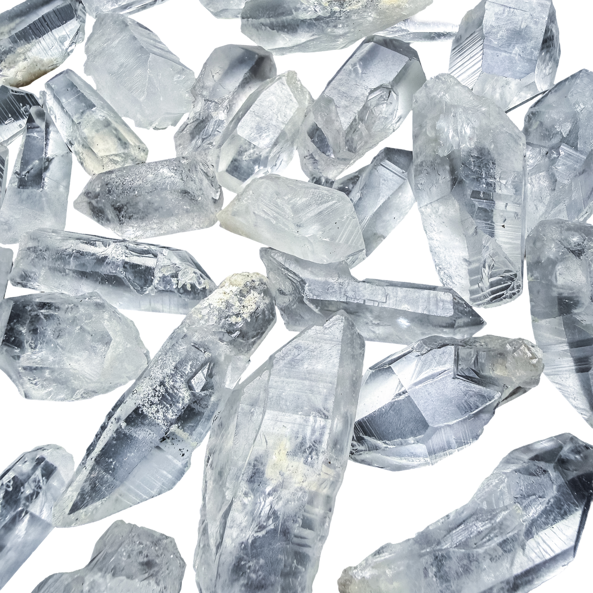 A scatter of A-grade Lemurian Quartz points from Minas Gerais, Brazil, 1 to 2 inches, showing the horizontal ladder striations.