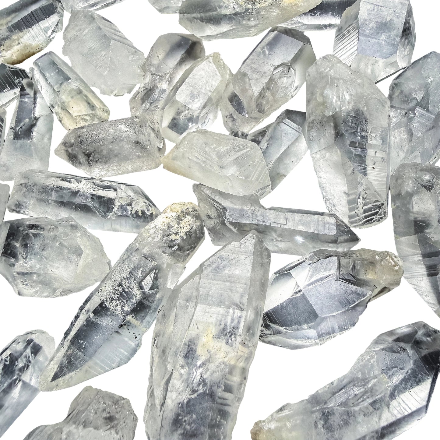 Back view of Lemurian Quartz points showing natural surface texture and matrix contact