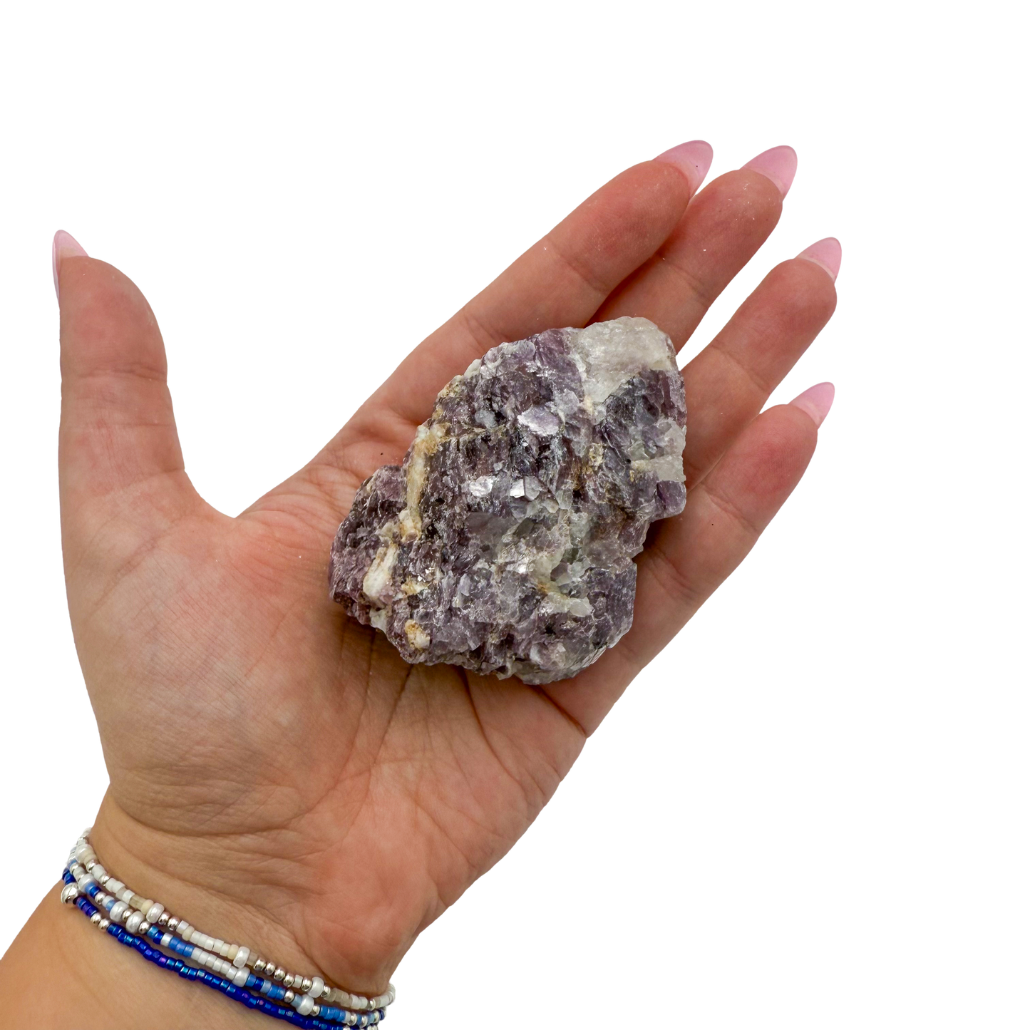 Lepidolite crystal specimen from Brazil held in hand to show scale