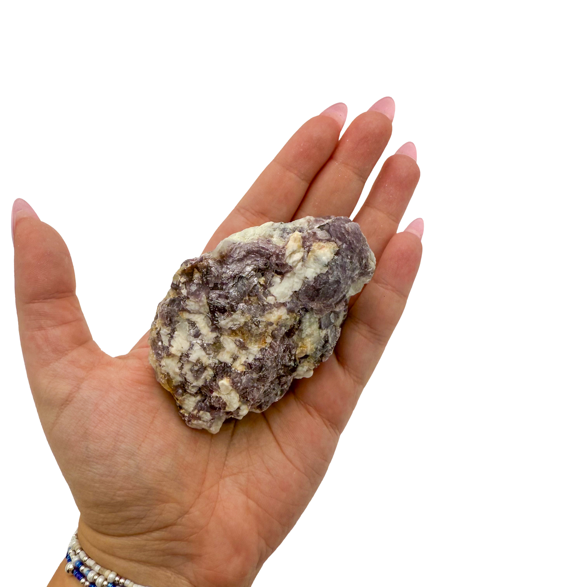 Lepidolite crystal specimen from Brazil held in hand to show scale