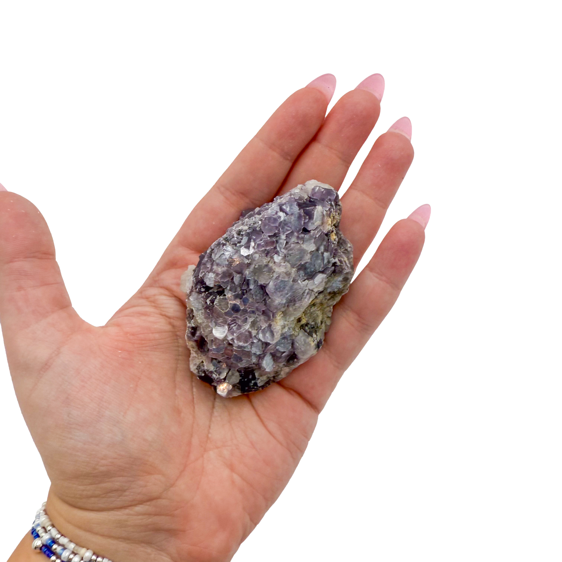 Lepidolite crystal specimen from Brazil held in hand to show scale
