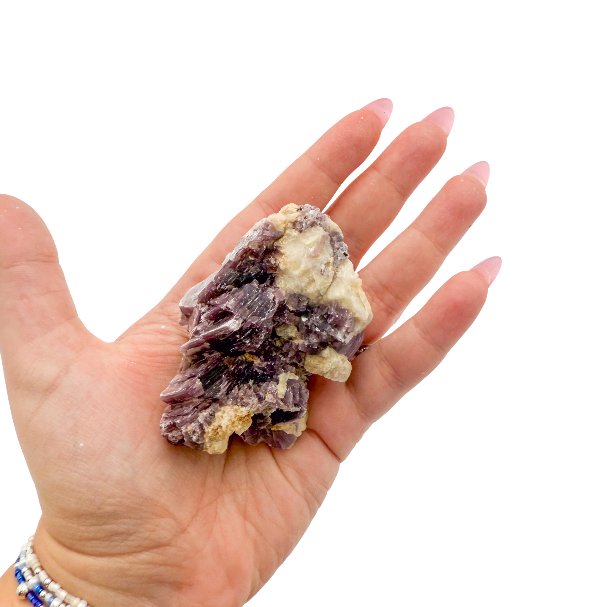 Lepidolite crystal specimen from Brazil held in hand to show scale
