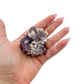 Lepidolite crystal specimen from Brazil held in hand to show scale
