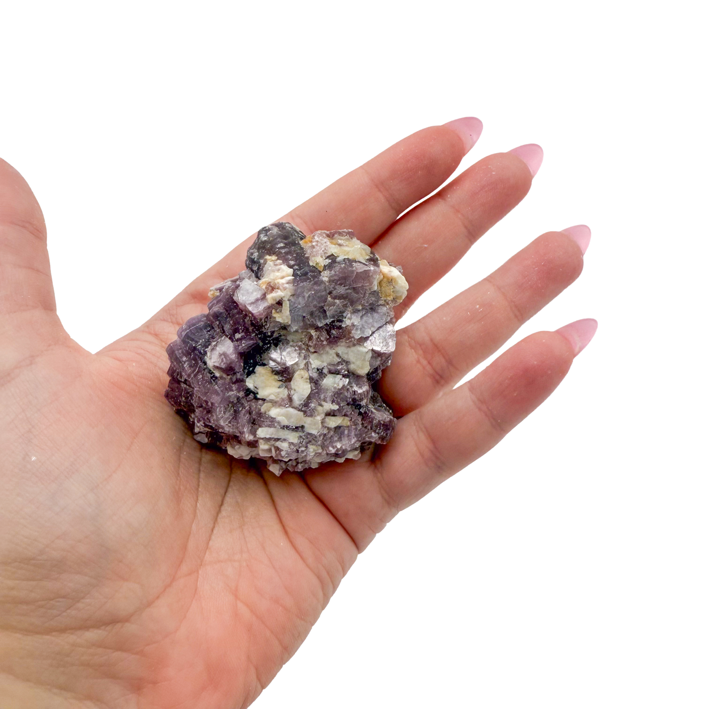 Lepidolite crystal specimen from Brazil held in hand to show scale
