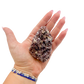 Lepidolite crystal specimen from Brazil held in hand to show scale