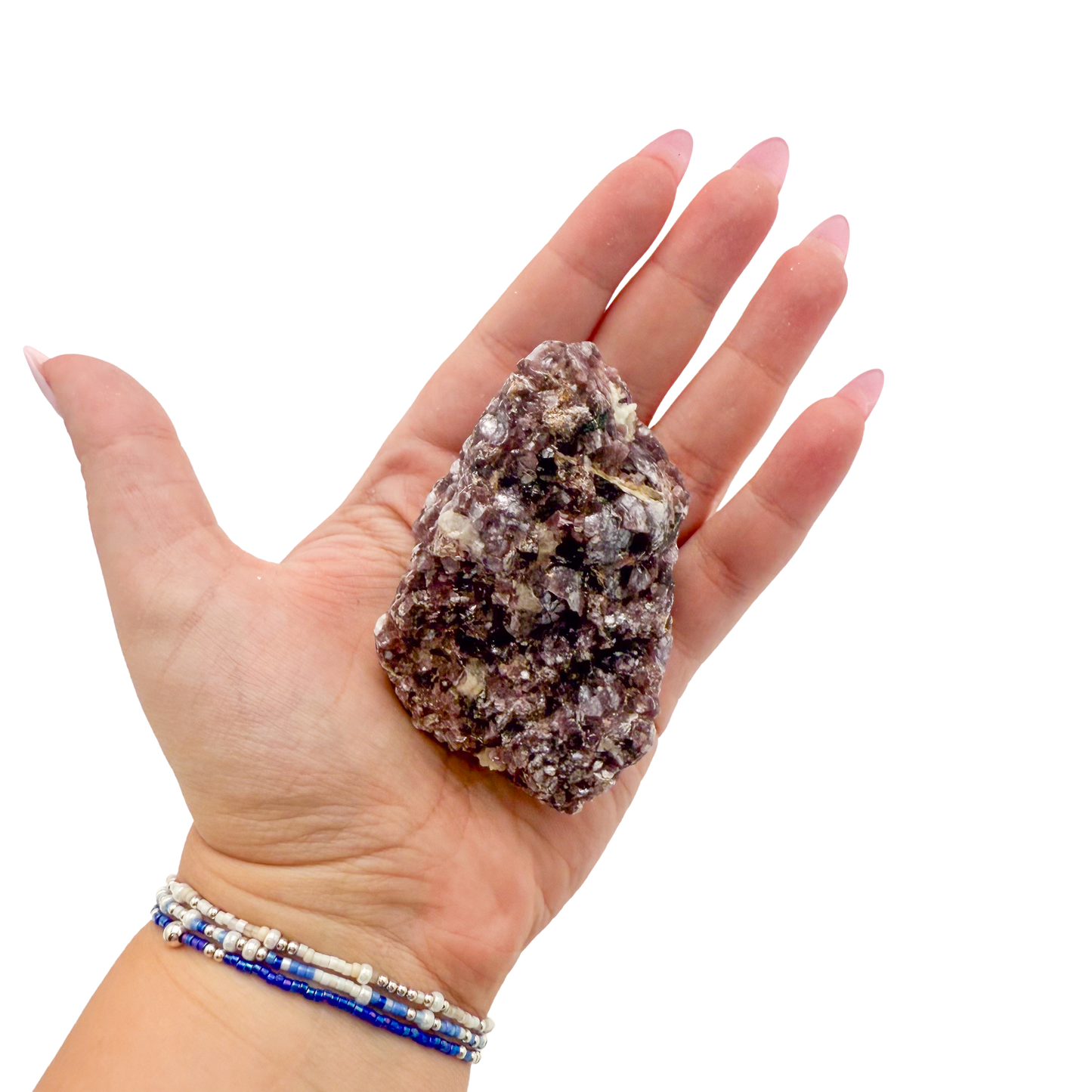 Lepidolite crystal specimen from Brazil held in hand to show scale