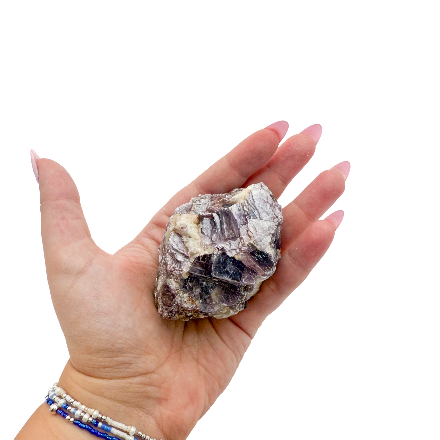 Lepidolite crystal specimen from Brazil held in hand to show scale