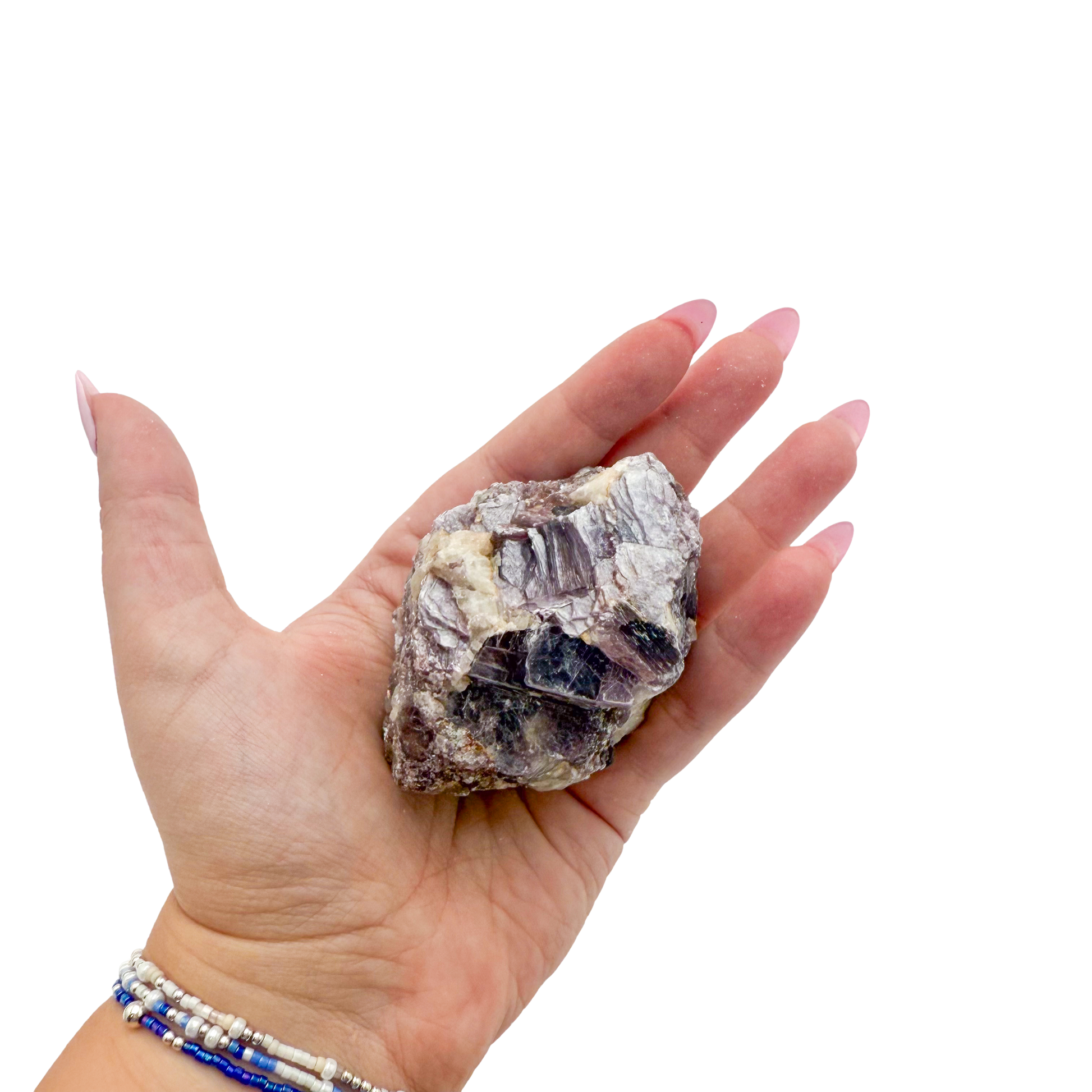 Lepidolite crystal specimen from Brazil held in hand to show scale