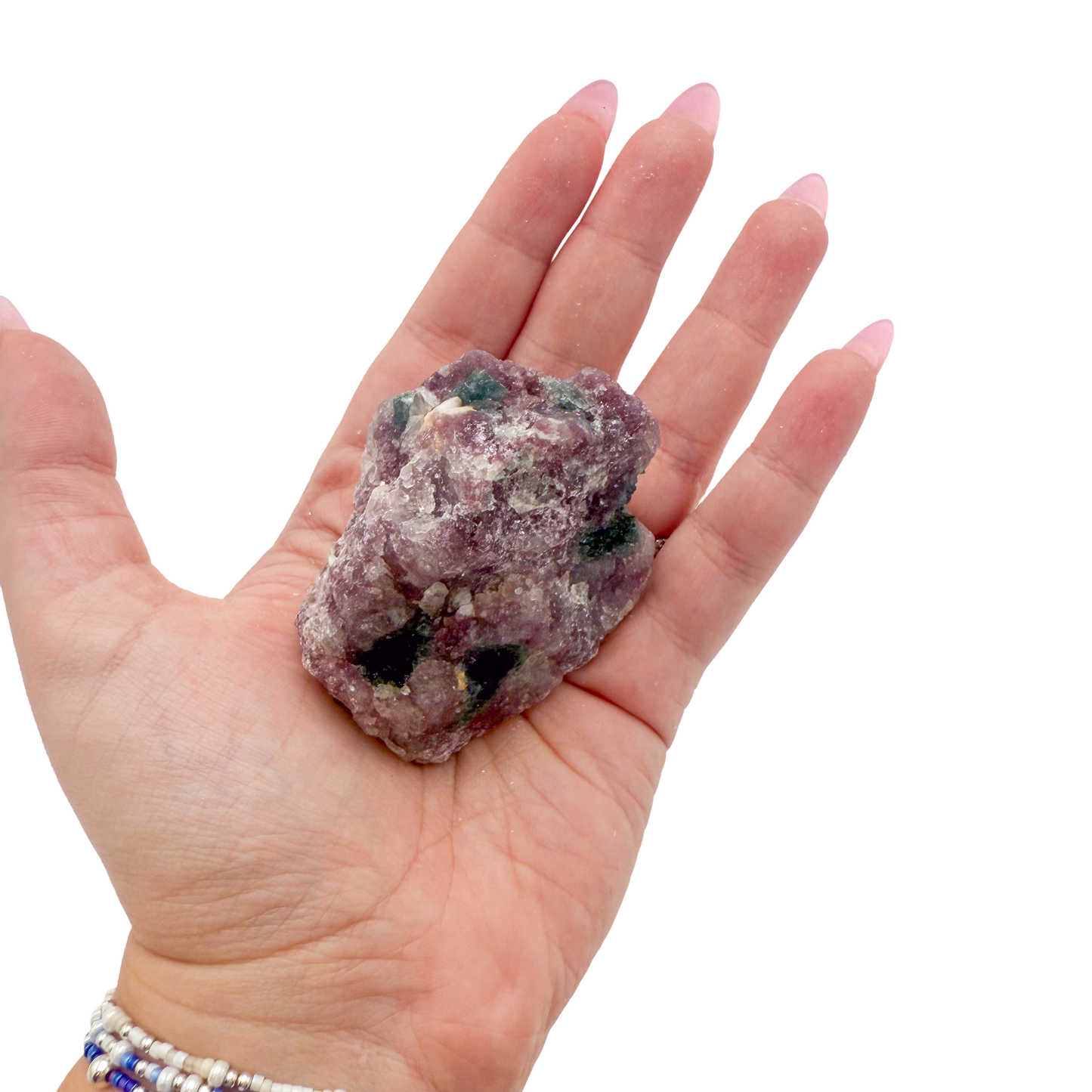 Lepidolite crystal specimen from Brazil held in hand to show scale