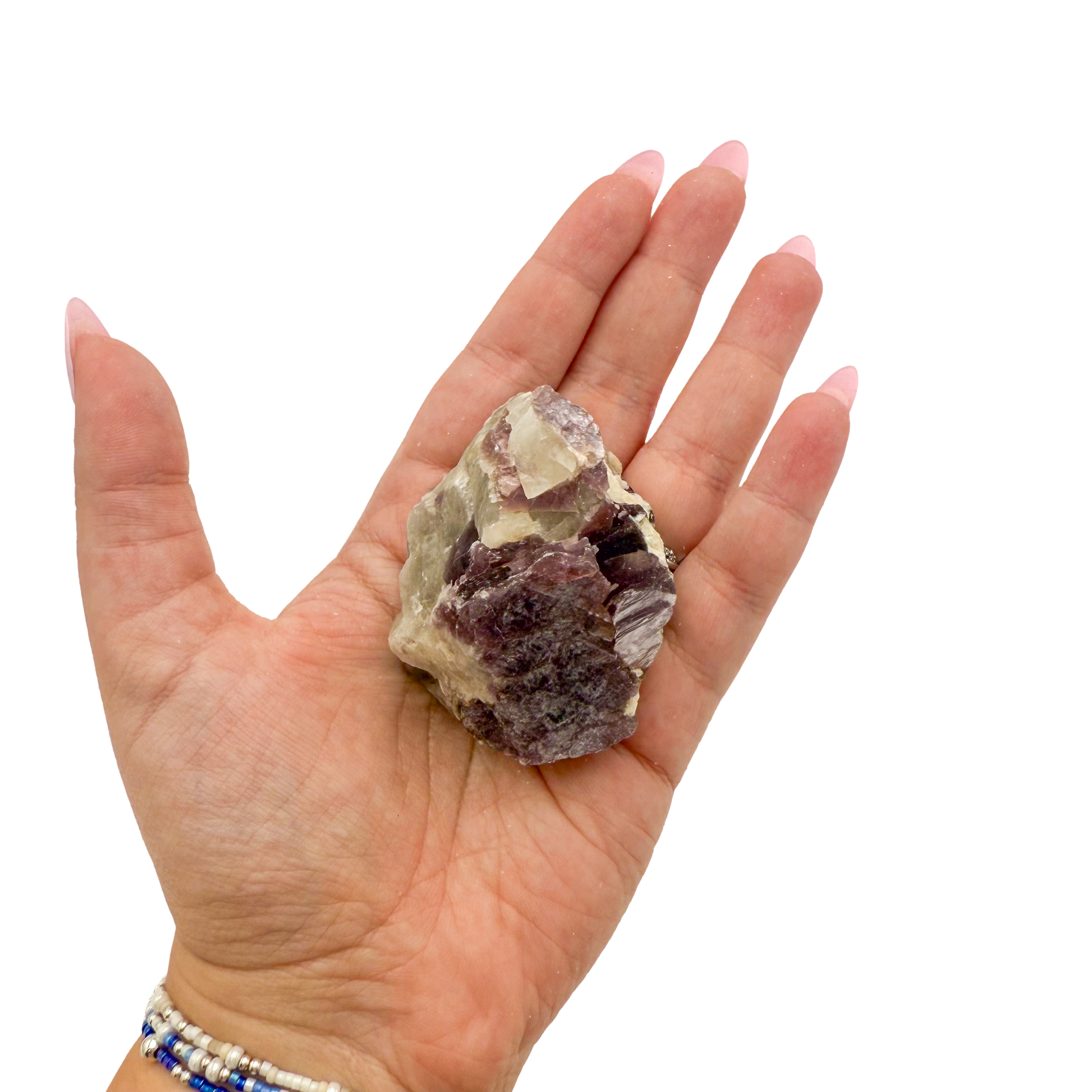 Lepidolite crystal specimen from Brazil held in hand to show scale