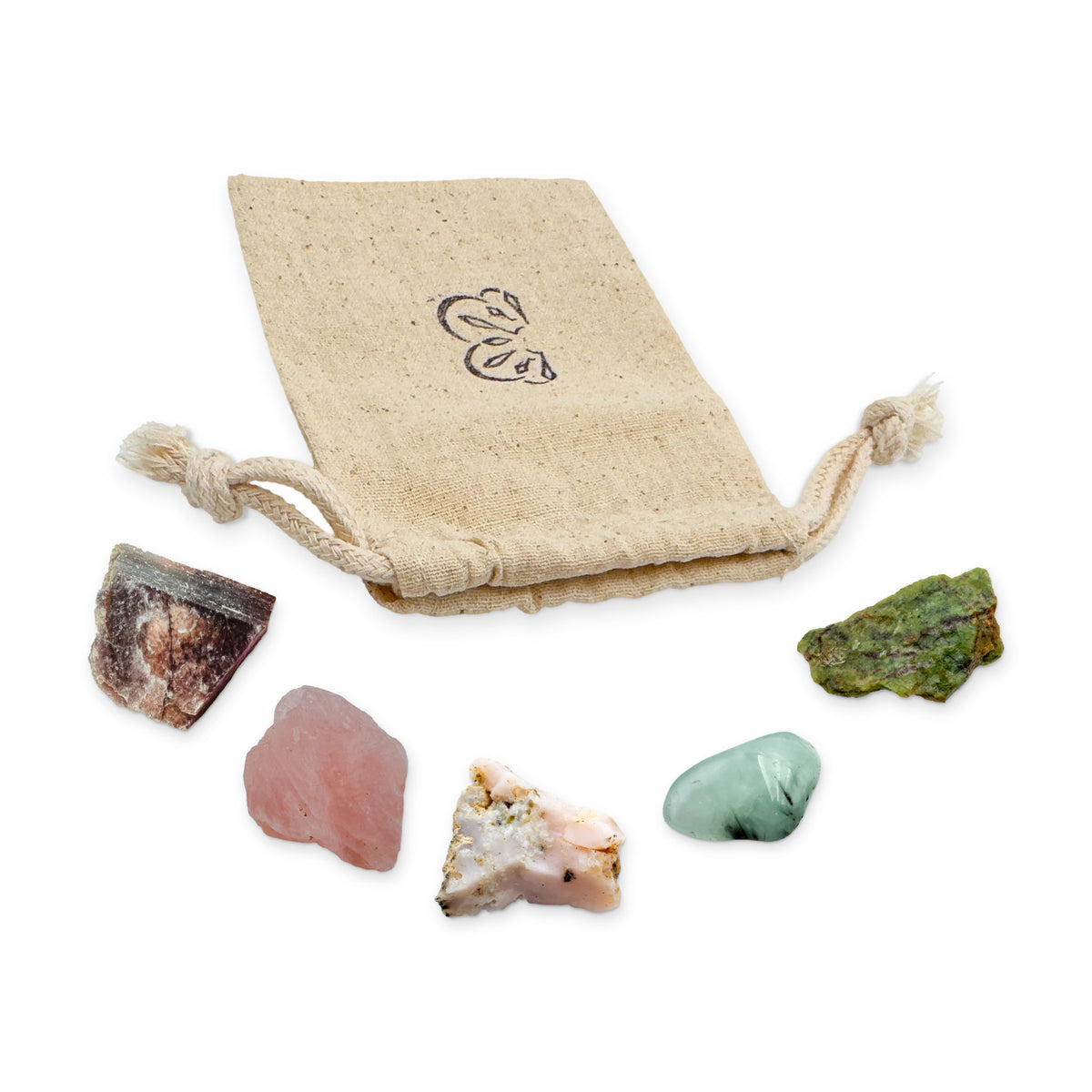 Libra Crystal Kit: lepidolite, rose quartz, pink opal, prehnite and chrysoprase, arranged with the reusable cotton bag they come in, on white