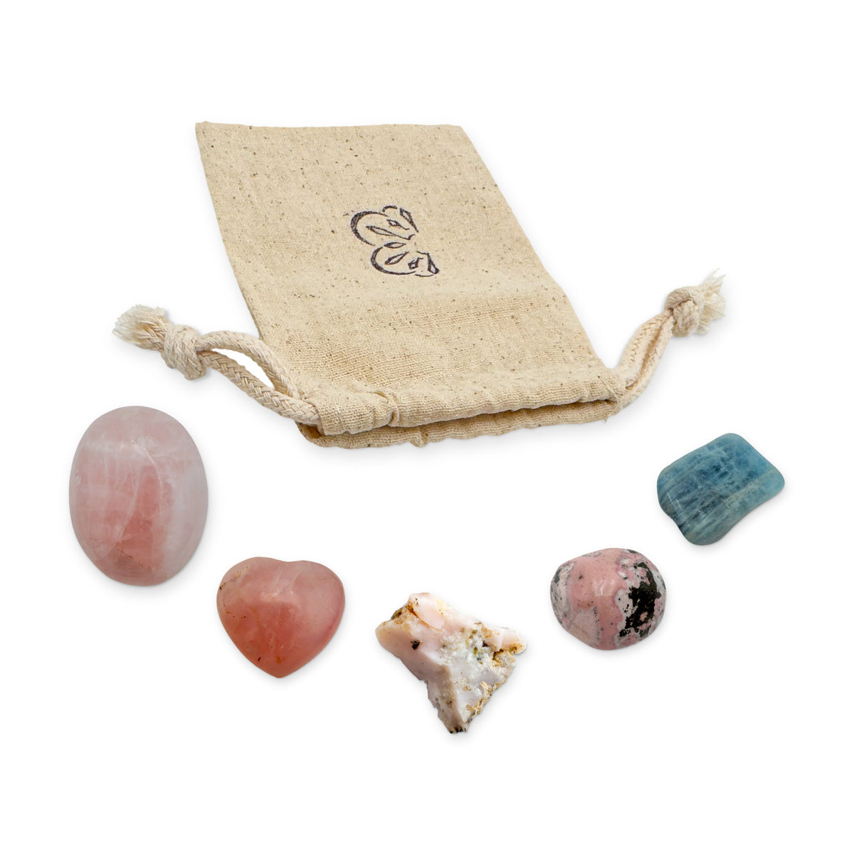 Love Crystal Kit: rose quartz palm stone, rose quartz heart, pink opal, rhodonite and aquamarine, arranged with the reusable cotton bag they come in, on white