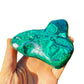 Side-on view of Malachite specimen, worked with for Emotional Healing and Protection, showing tight grain.