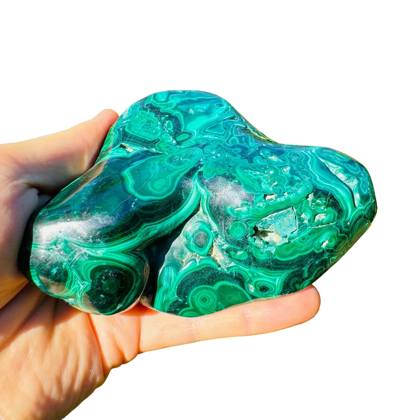 Bird's-eye view of Malachite specimen, often worked with for Emotional Healing, showing raw matrix.