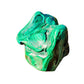 Held in hand is a Malachite specimen, shown for shape and scale.