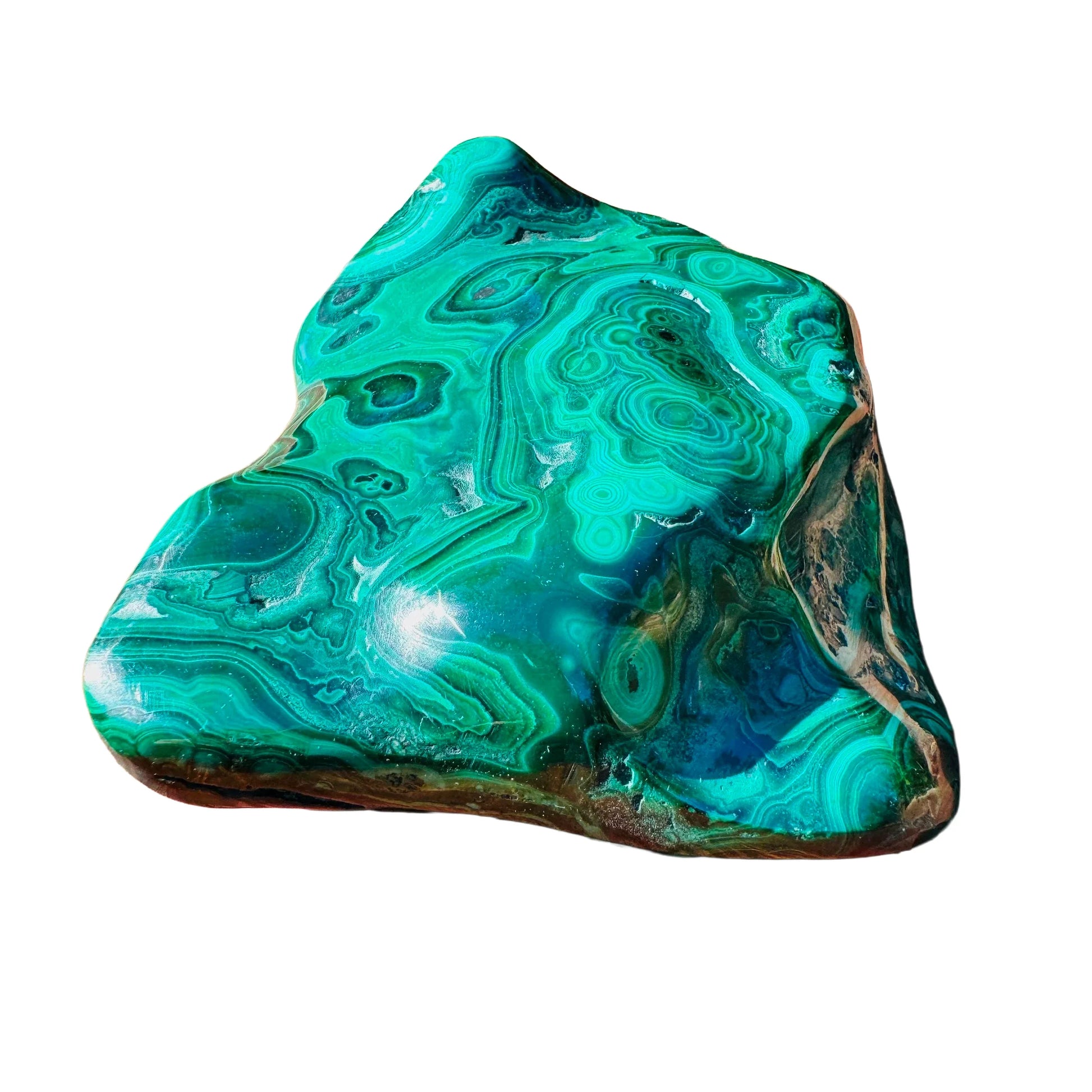 Holding a Malachite specimen, associated with Emotional Healing, with depth visible across the surface.