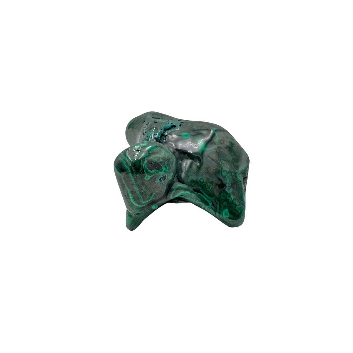 Malachite specimen turned to show a pointed knob catching the light above a flatter banded base.