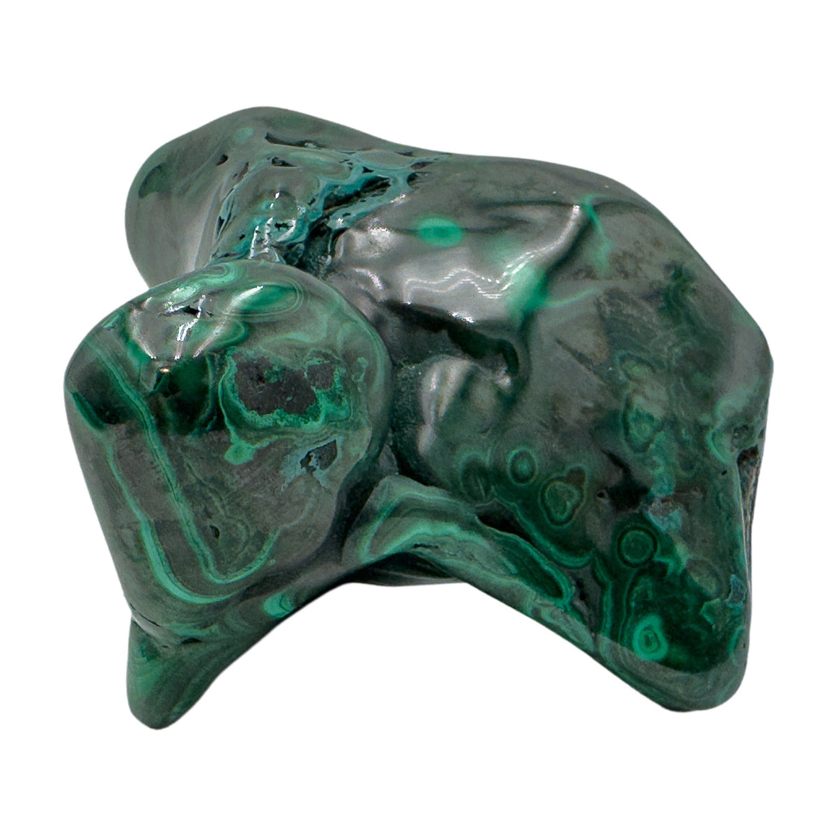 Malachite specimen turned to show a pointed knob catching the light above a flatter banded base.