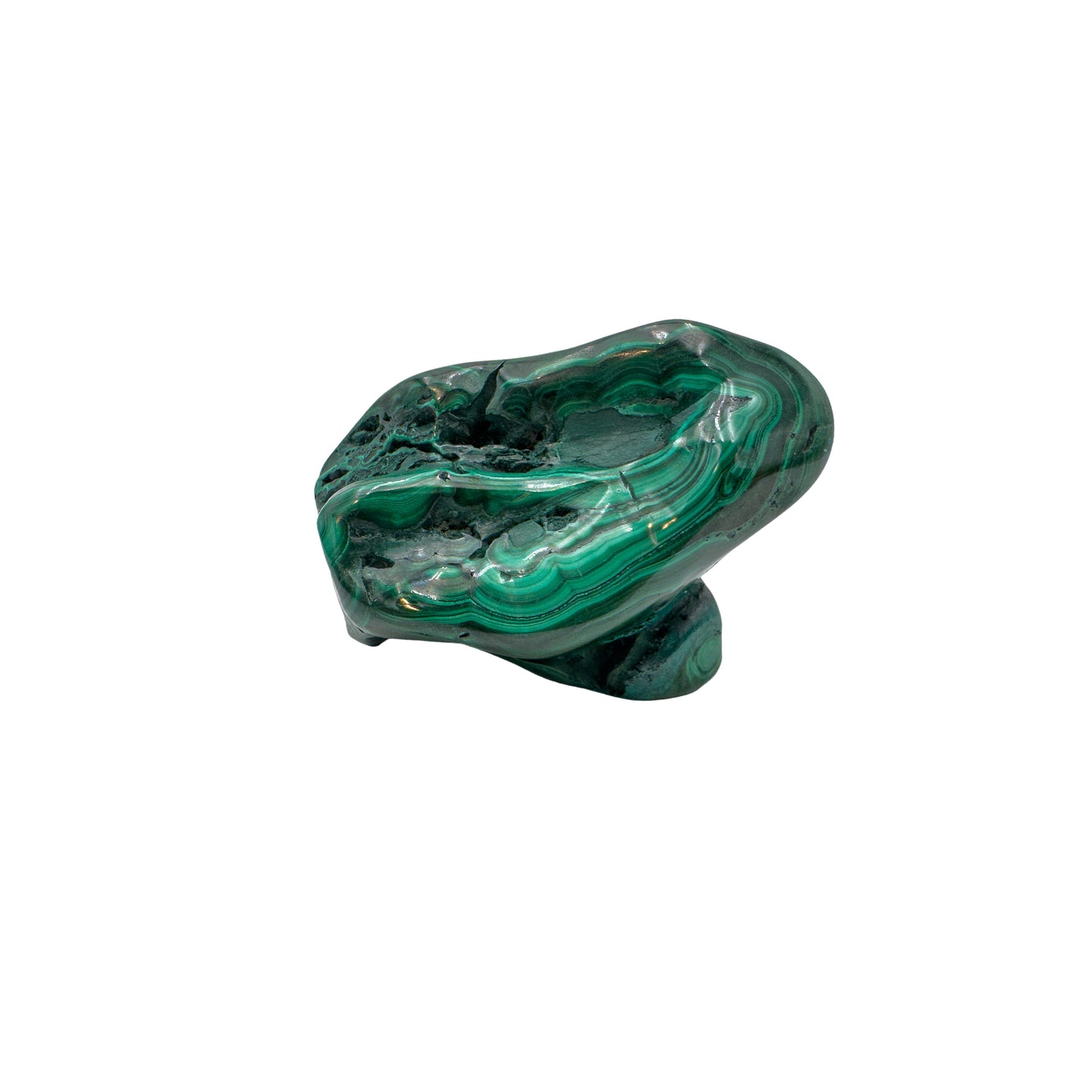 Malachite specimen viewed from a rounded angle, showing rings of banding across its lower half.