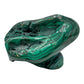 Malachite specimen viewed from a rounded angle, showing rings of banding across its lower half.