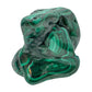 Compact angled view of the malachite specimen, showing tight rings of banding across its rounded faces.