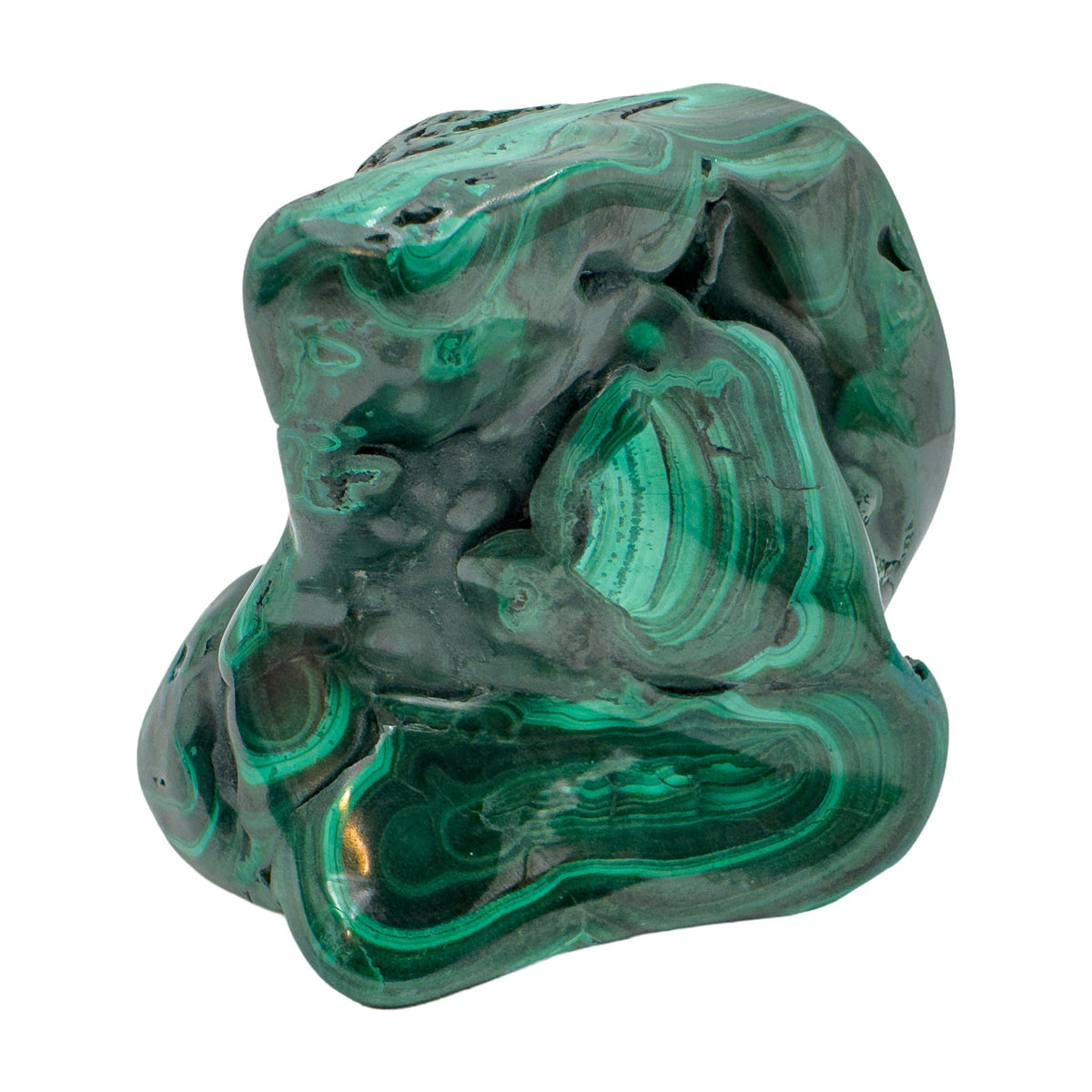 Compact angled view of the malachite specimen, showing tight rings of banding across its rounded faces.