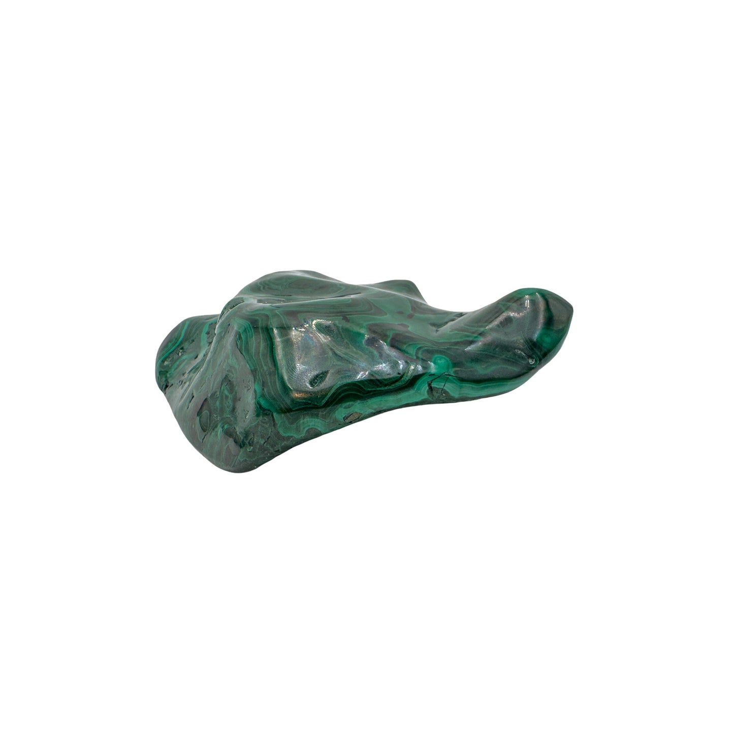 Close side profile of the malachite specimen, showing the jagged natural edge where the polish meets the raw stone.
