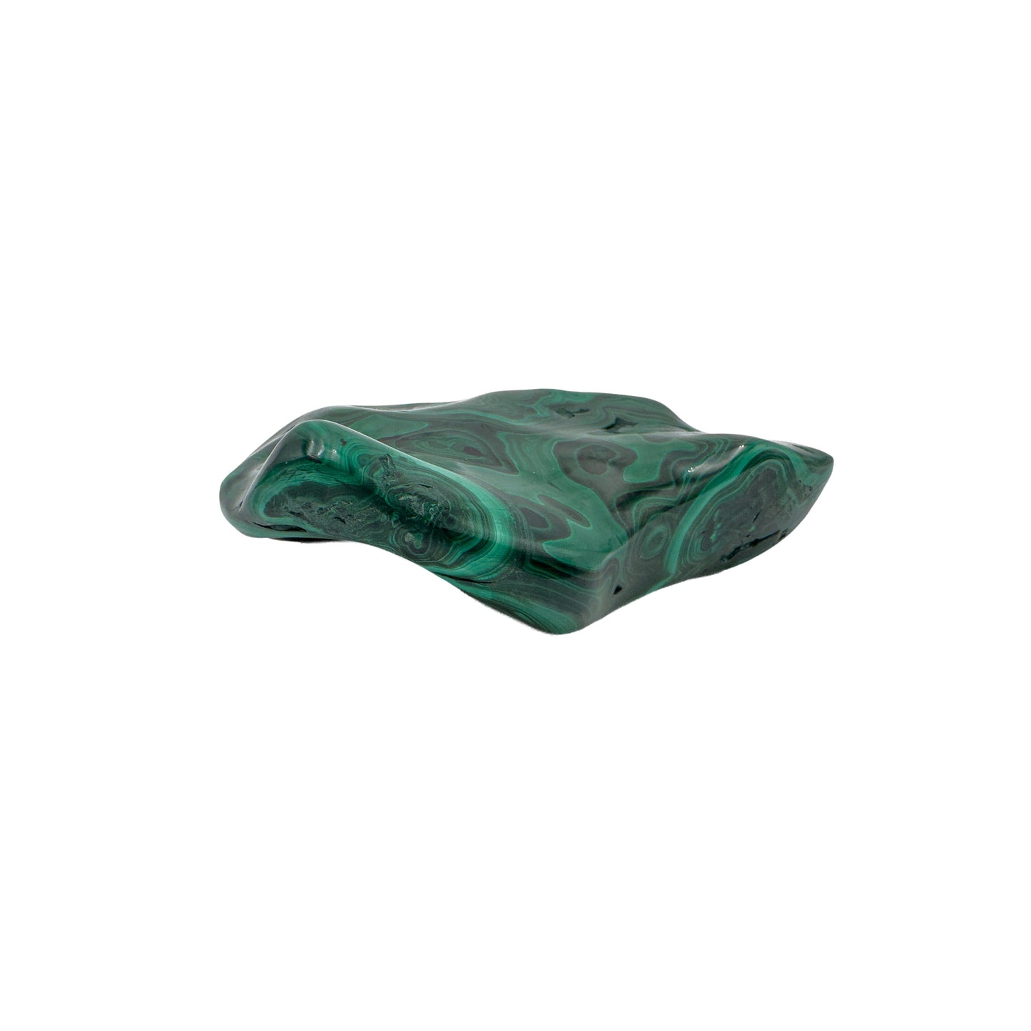Overhead view of the malachite specimen's flat top, with concentric green bands spreading across the full face.