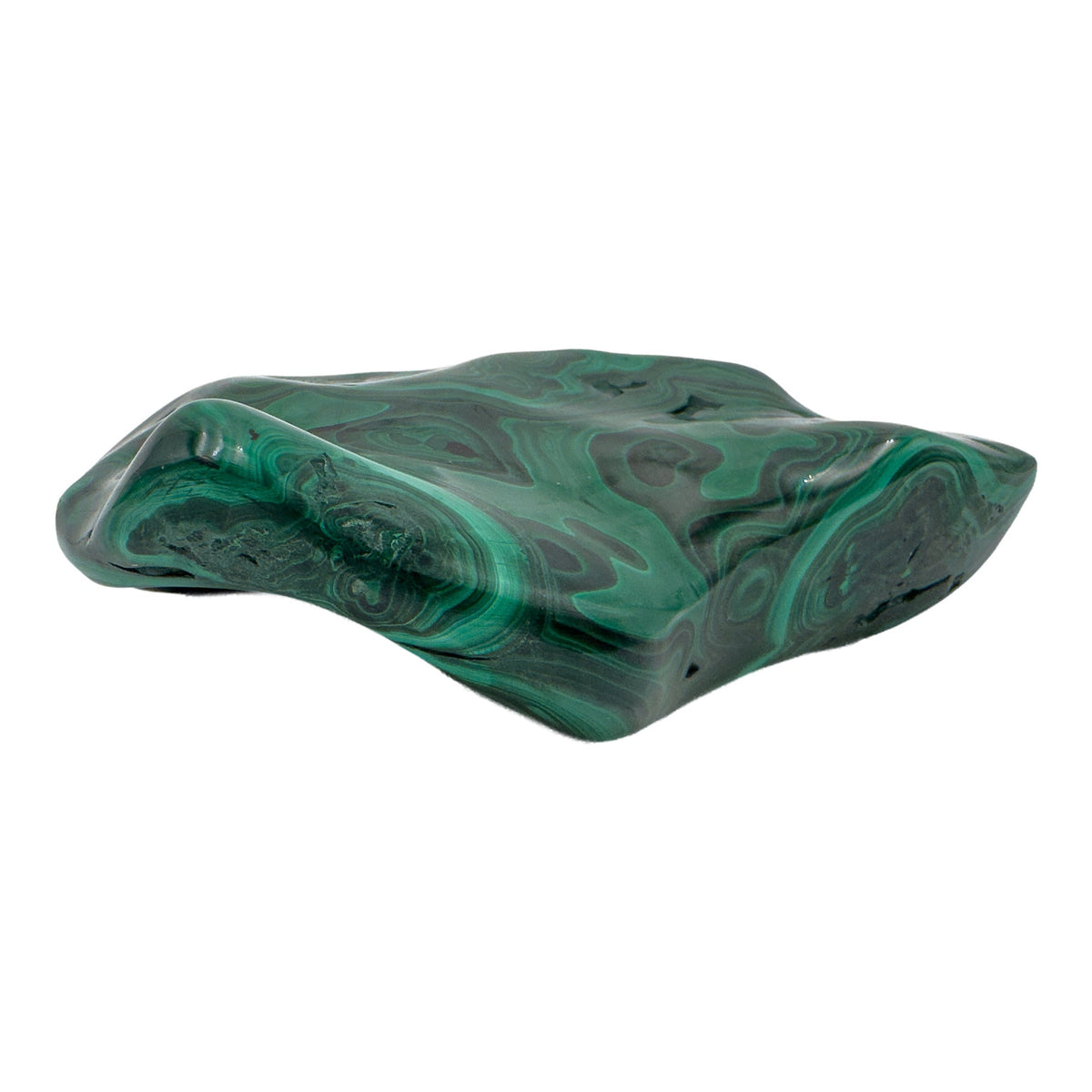 Overhead view of the malachite specimen's flat top, with concentric green bands spreading across the full face.