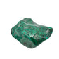 Front-facing view of the malachite specimen's widest face, with sweeping green and gray bands across the polish.