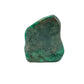 Malachite specimen angled to show a raw, unpolished patch across its crown above the banded body.