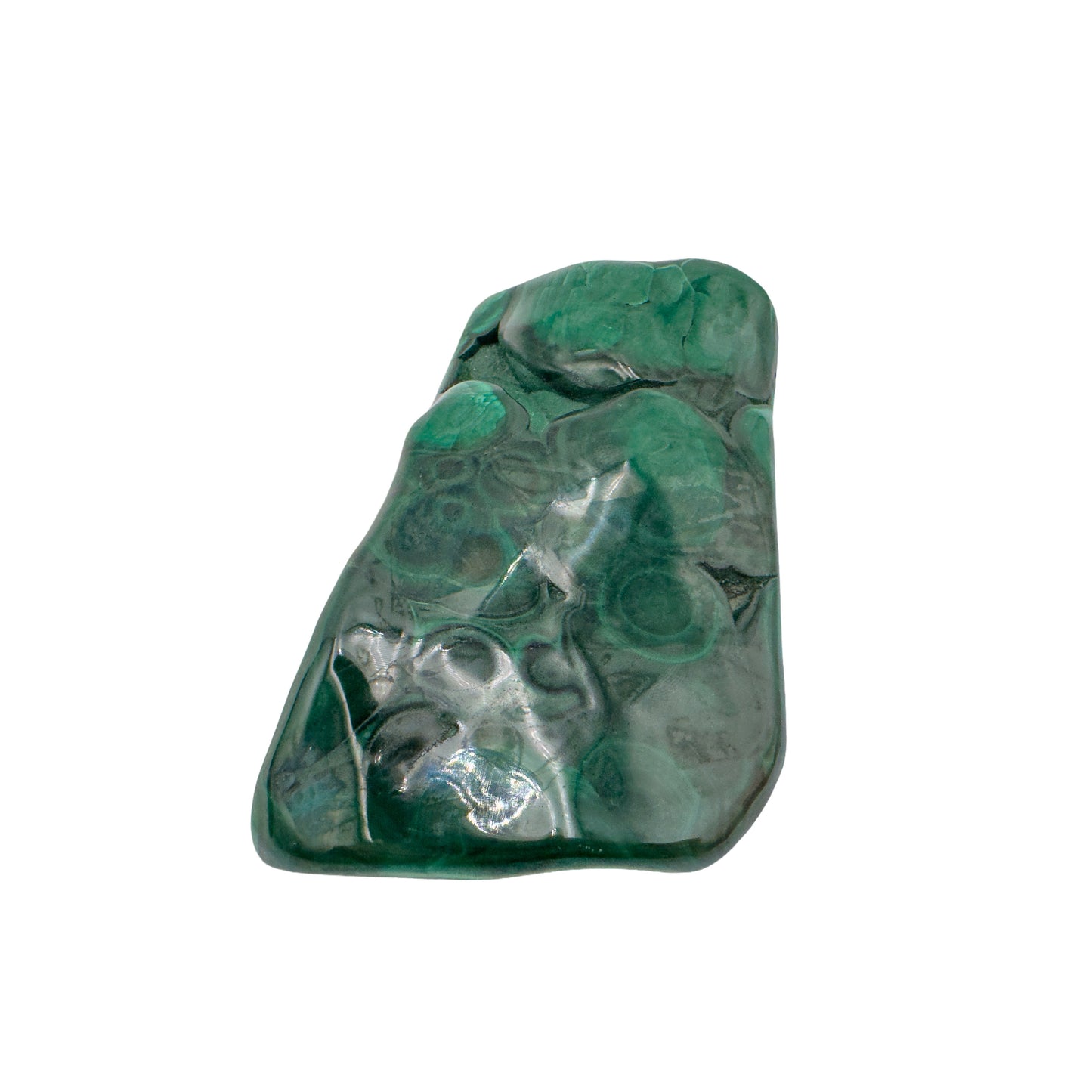 The same elongated malachite specimen stood upright, showing banding running the length of the stone.