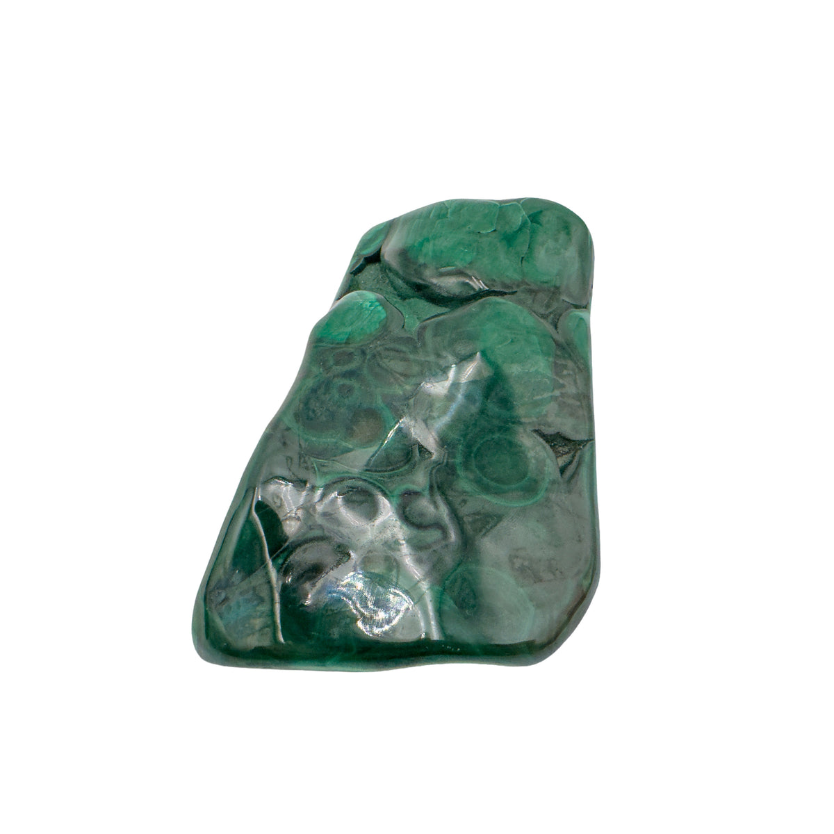 The same elongated malachite specimen stood upright, showing banding running the length of the stone.