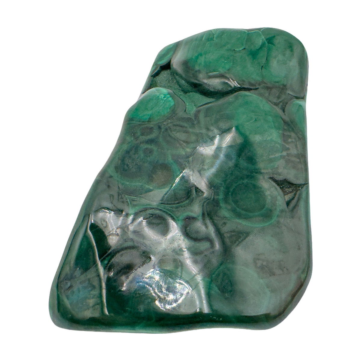 The same elongated malachite specimen stood upright, showing banding running the length of the stone.