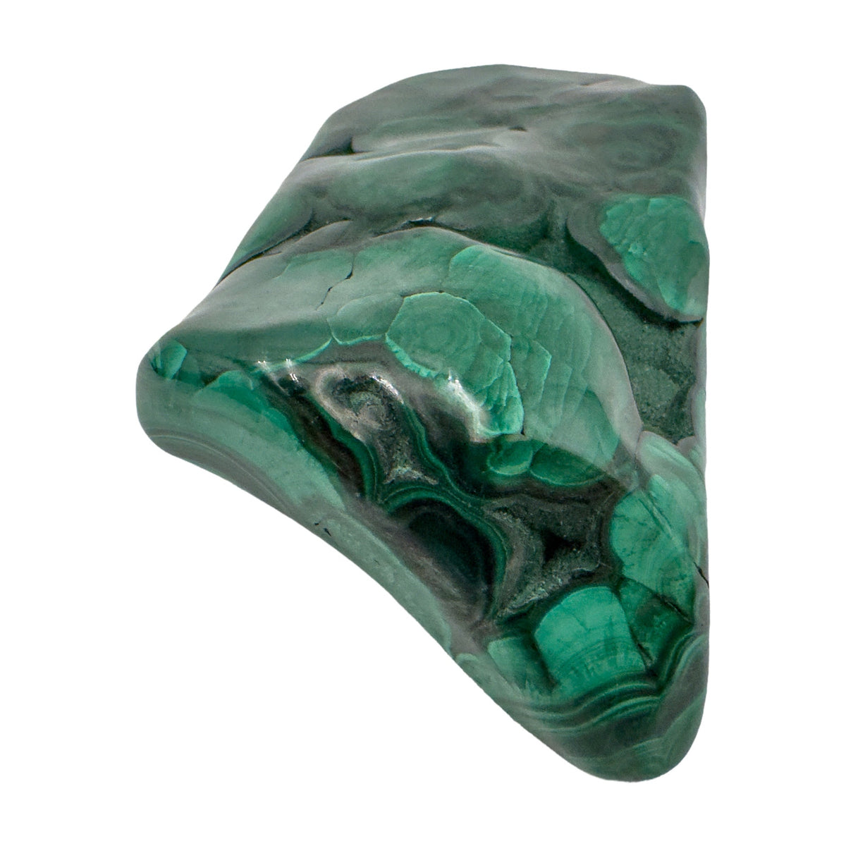 Close angled view of the malachite specimen's narrower end, tapering to a rounded point.
