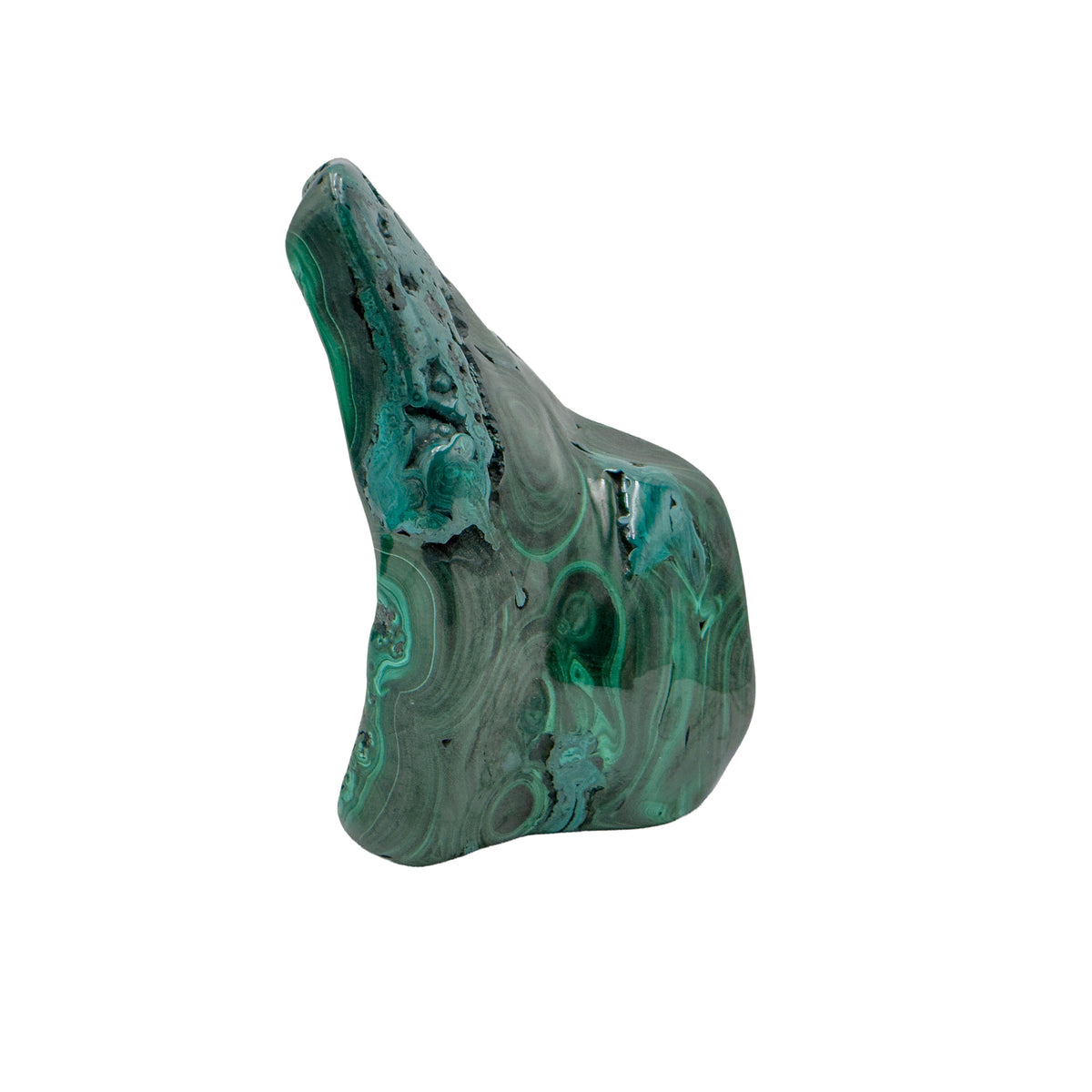 Side angle of the malachite specimen's chunkier face, with softer, less defined banding.