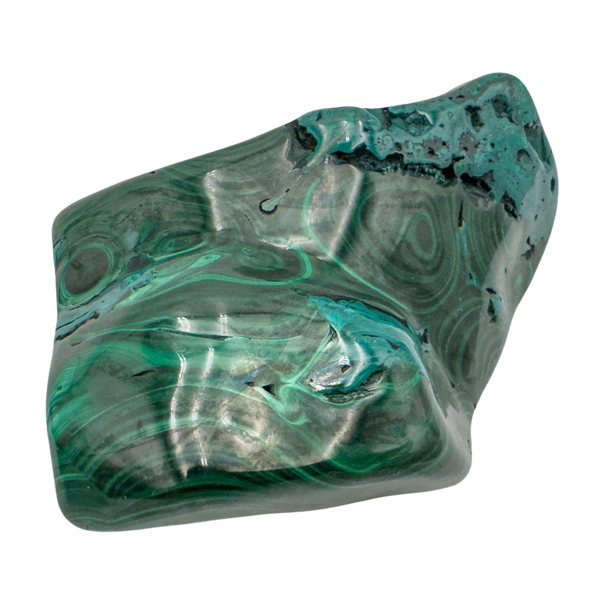 Wider angled view of the malachite specimen, showing concentric ring banding beside a raw patch at the upper left.