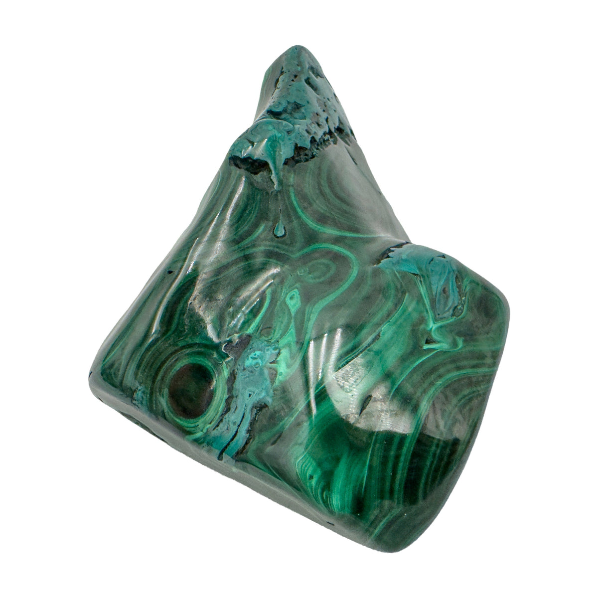 Malachite specimen photographed from below, its peaked silhouette rising above the banded base.