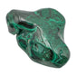 Malachite specimen turned to reveal a dark recessed pocket between two of its lobed peaks.