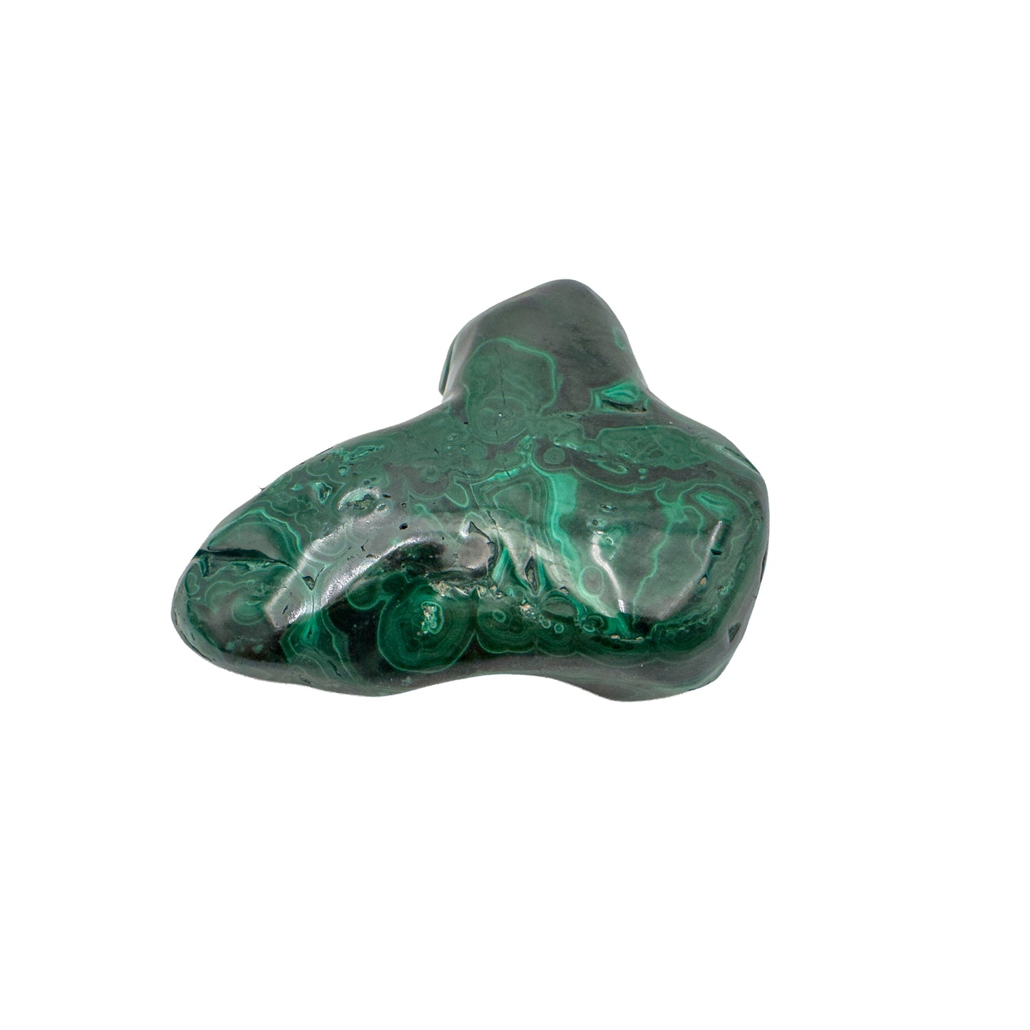 Low side angle of the malachite specimen, showing its horizontal profile and banding running along the base.