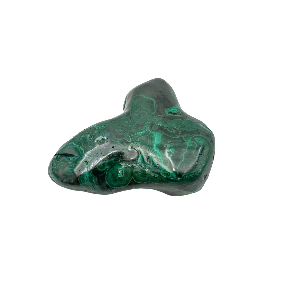 Low side angle of the malachite specimen, showing its horizontal profile and banding running along the base.