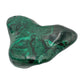 Mirrored front view of the malachite specimen, with banding wrapping around its irregular lobed form.