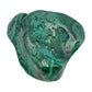 Malachite specimen angled to highlight its tallest pointed lobe rising above the banded body.